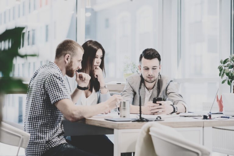 A team discussing financial plans around a table